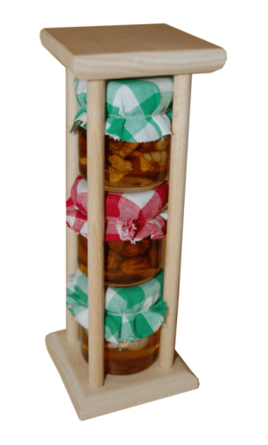 Satz Nüsse in Honig in antiken Säulen - Reklamnepredmety